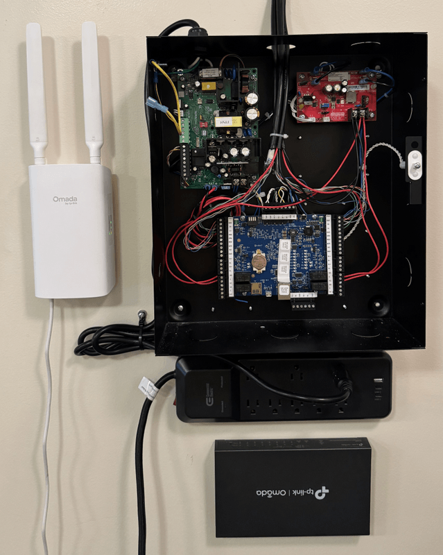 Wall-mounted LVEC access control panel with network switch and wireless access point