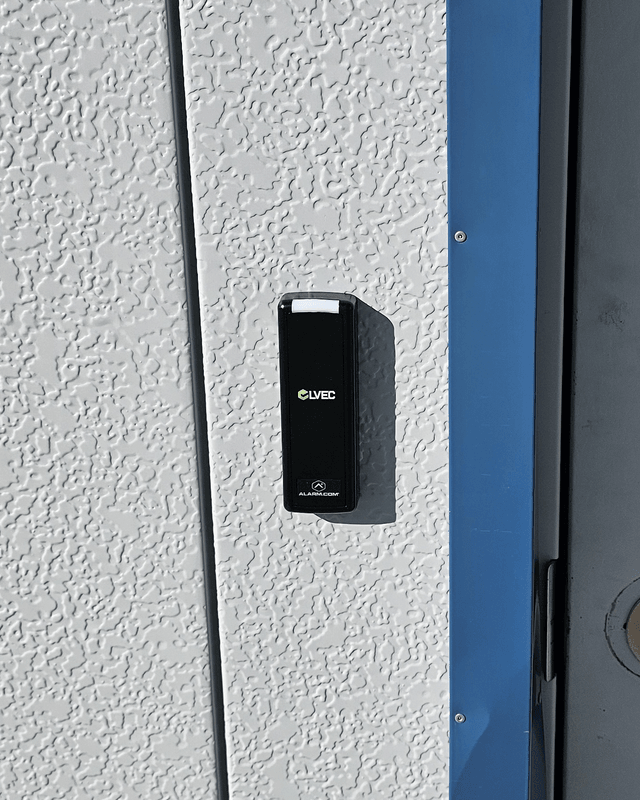 LVEC badge reader mounted beside an exterior steel door