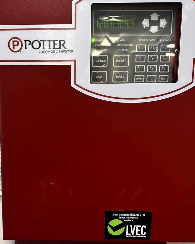 Fire alarm control panel with an LVEC monitoring sticker